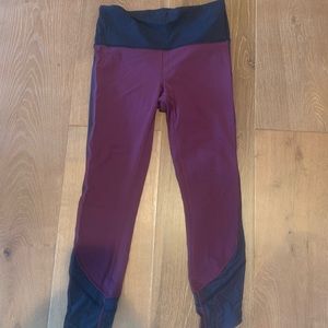 Maroon and black lululemon leggings (cropped)